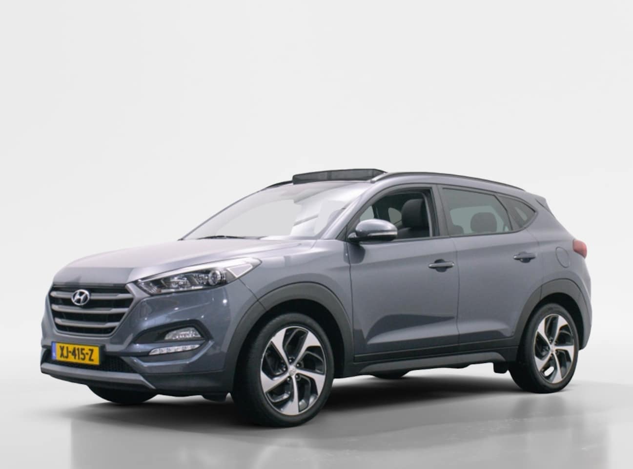 Hyundai Tucson - 1.6T 177pk 4WD Anniversary Automaat | Trekhaak 1.600kg | Panodak - AutoWereld.nl
