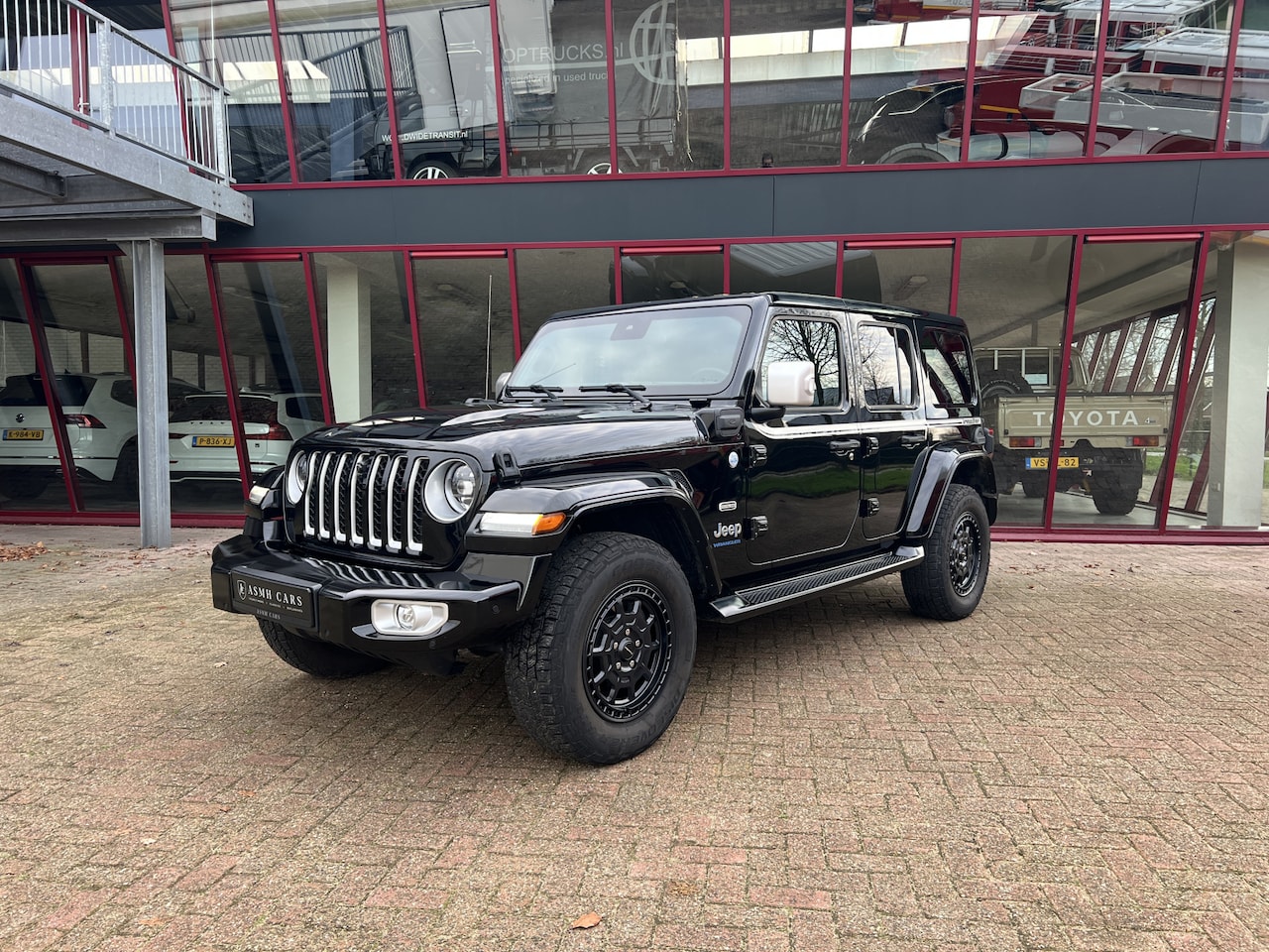 Jeep Wrangler Unlimited - 4xe 380 Sahara | Irmscher | Cross | Camera voor | - AutoWereld.nl