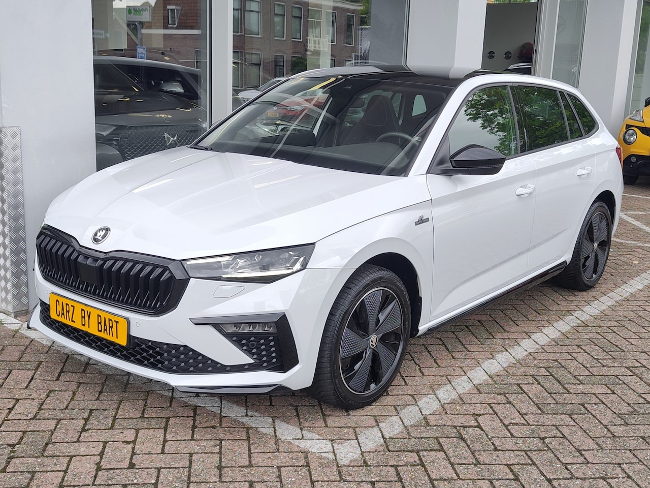 Skoda Scala - 1.0 TSI MONTE CARLO DSG Panoramadak | Keyless | Stuurwielverwarming - AutoWereld.nl