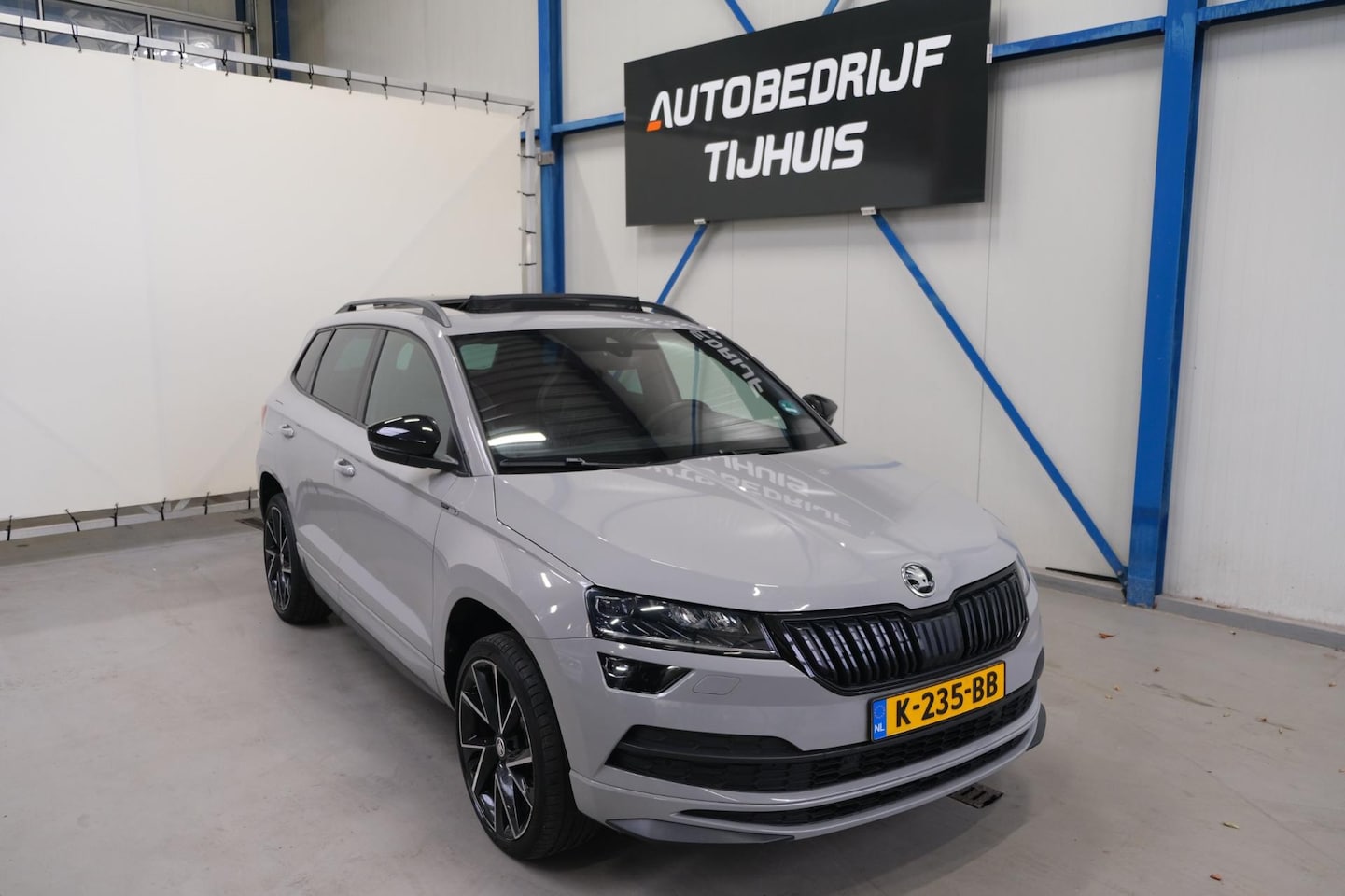 Skoda Karoq - 1.5 TSI ACT Sportline Business - N.A.P. Airco, Cruise, Navi, PDC, Camera, Schuifdak, Trekh - AutoWereld.nl
