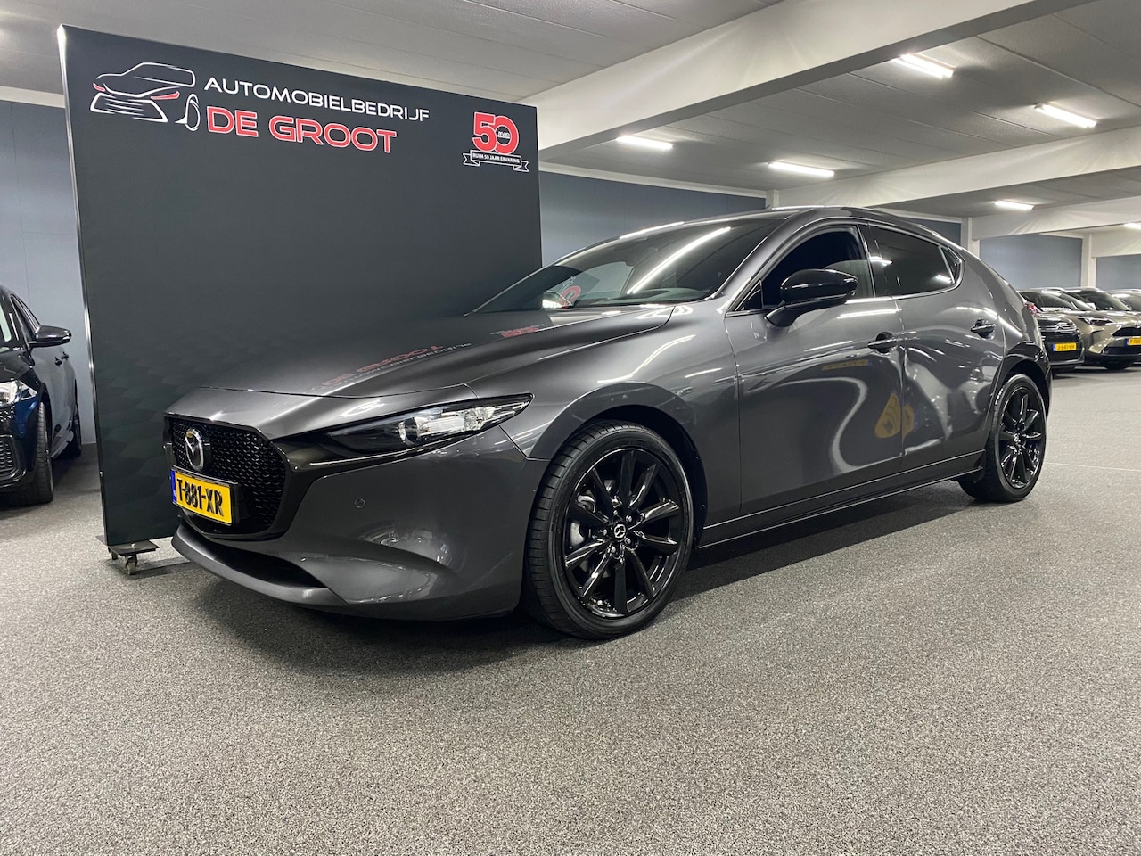 Mazda 3 - 2.0 e-SkyActiv-G M Hybrid 150 Homura/ Nederlandse auto/ Parkeersensoren/ Achteruitrijcamer - AutoWereld.nl