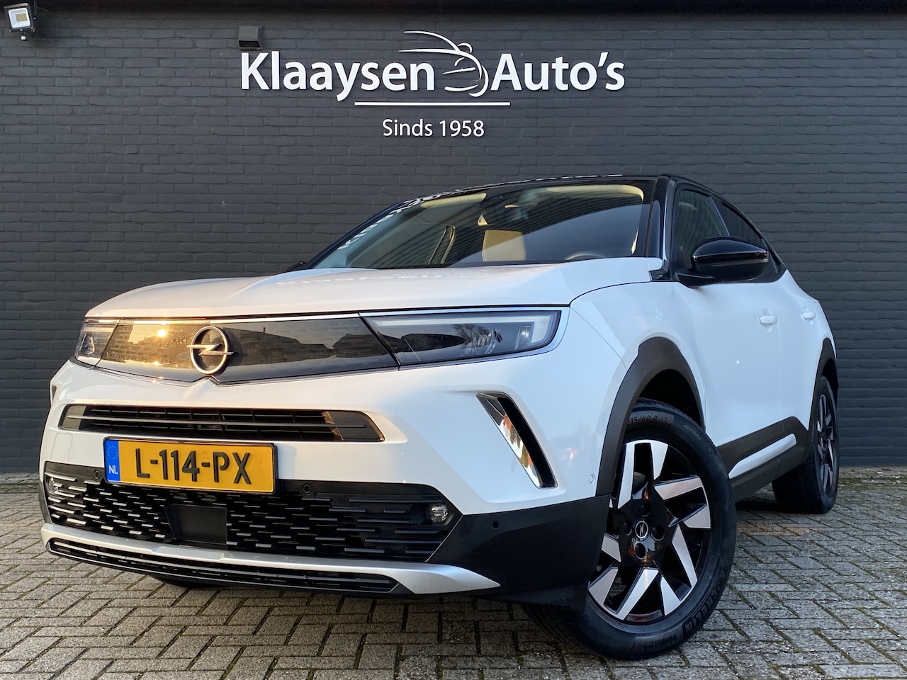 Opel Mokka-e - Business Elegance 50-kWh 11kw bl. | dealer onderh. | navigatie | trekhaak | camera | rij a - AutoWereld.nl