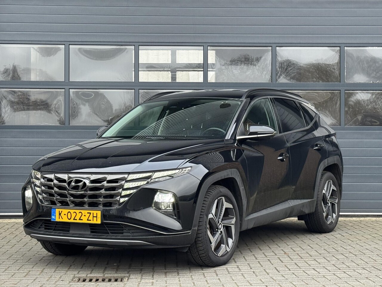 Hyundai Tucson - 1.6 T-GDI HEV PREMIUM I AUTOMAAT I APPLE CARPLAY I TREKHAAK I 360° CAMERA - AutoWereld.nl