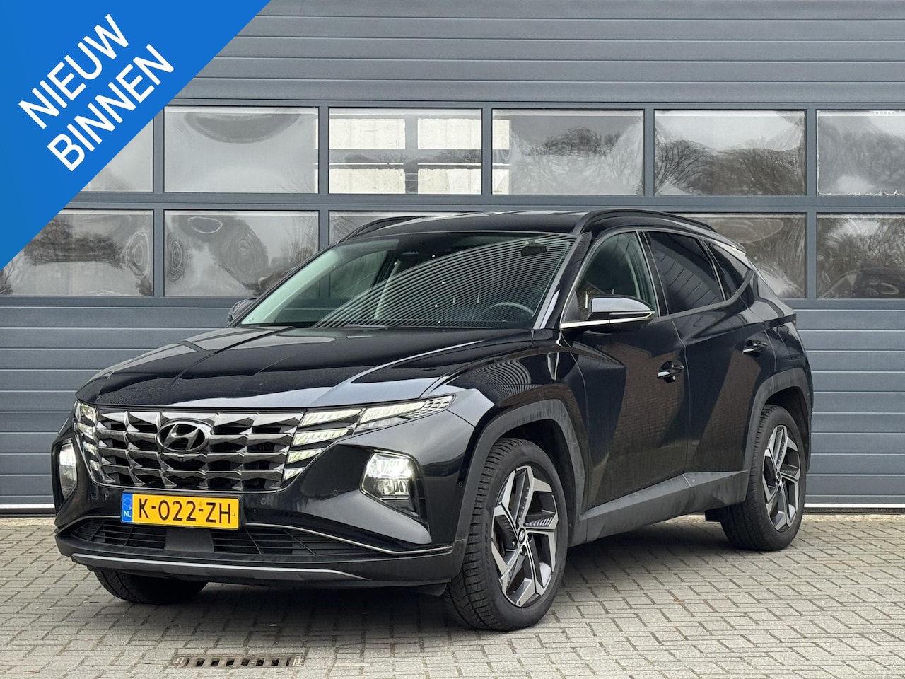 Hyundai Tucson - 1.6 T-GDI HEV PREMIUM I AUTOMAAT I APPLE CARPLAY I TREKHAAK I 360° CAMERA - AutoWereld.nl