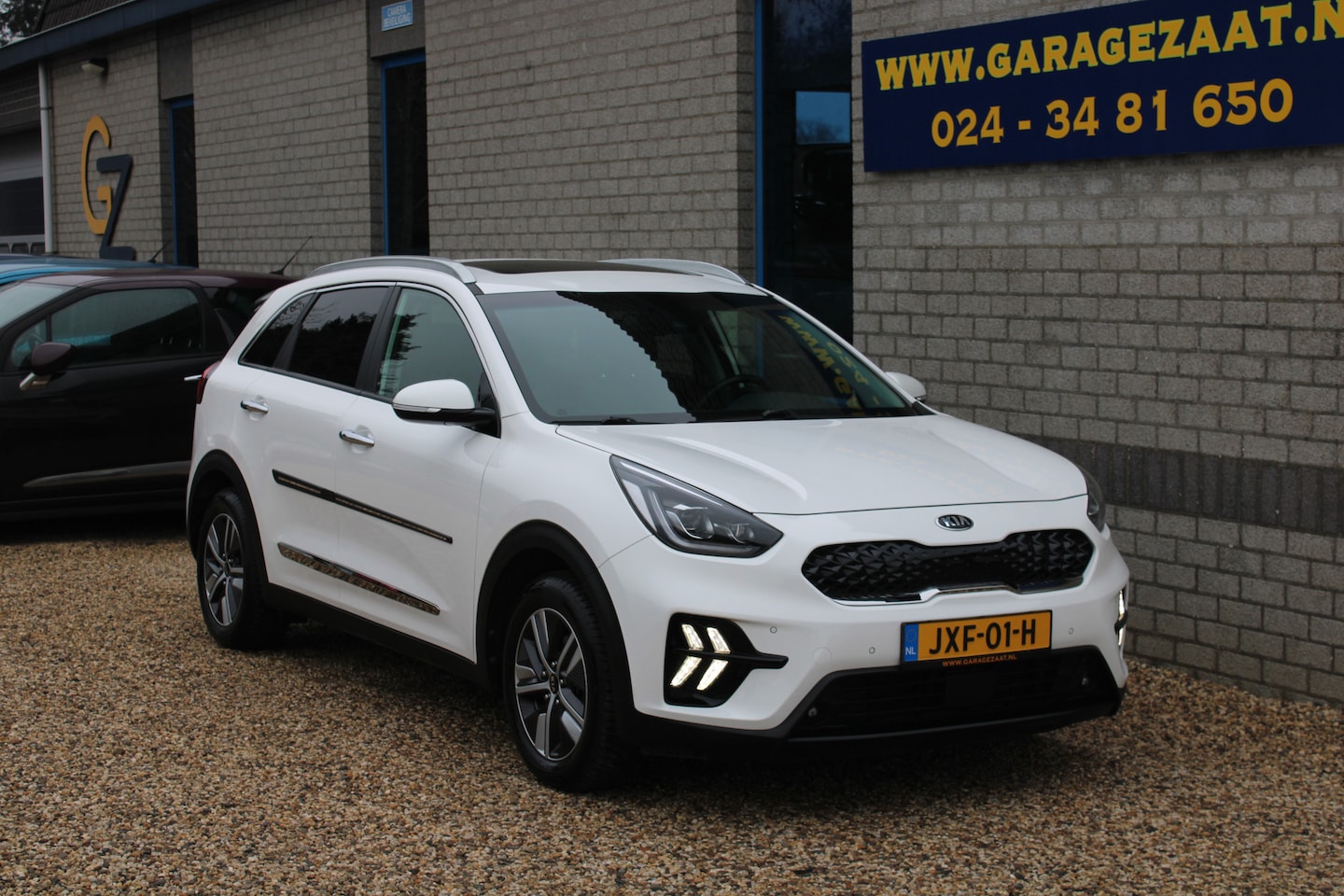 Kia Niro - 1.6 GDi PHEV BusinessLine leder schuifdak Trekhaak All season banden - AutoWereld.nl