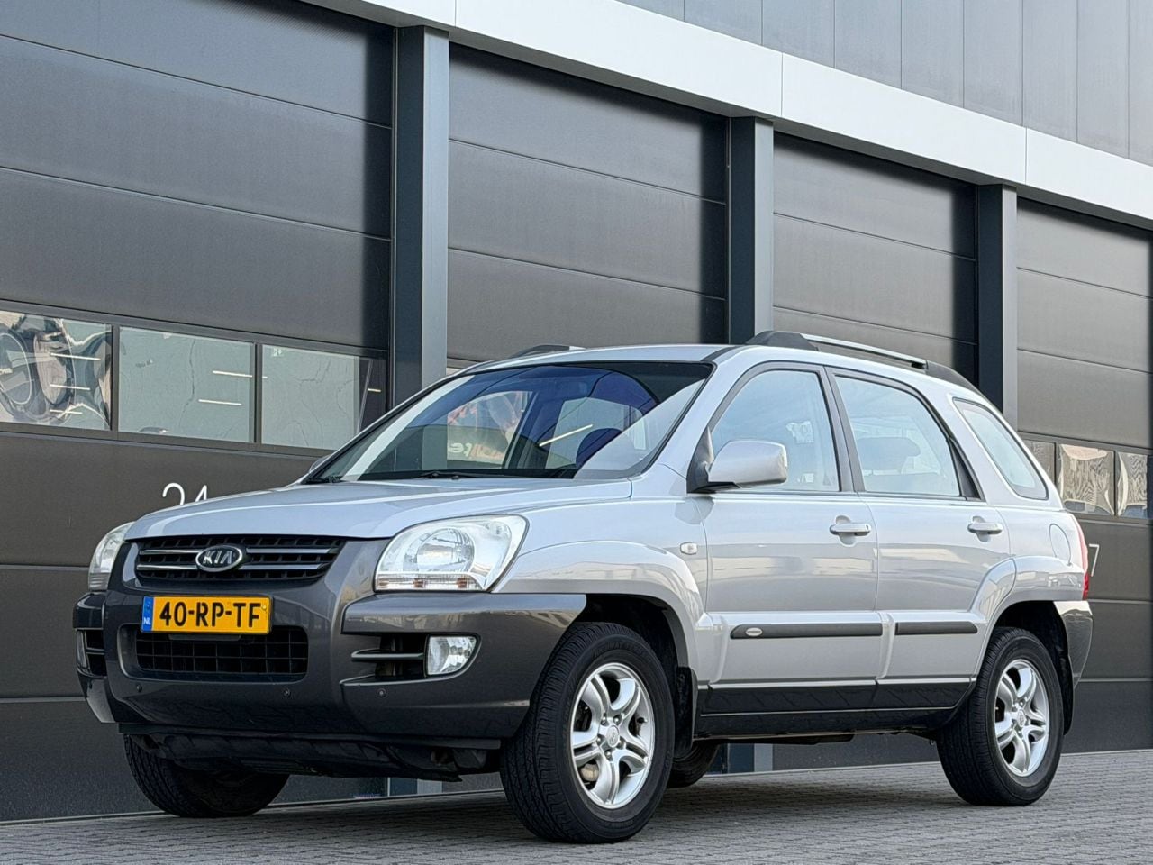 Kia Sportage - 2.0 CVVT Airco PDC - AutoWereld.nl