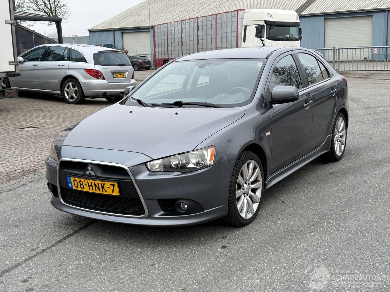 Mitsubishi Lancer - 1.8 Intense Navi PDC - AutoWereld.nl
