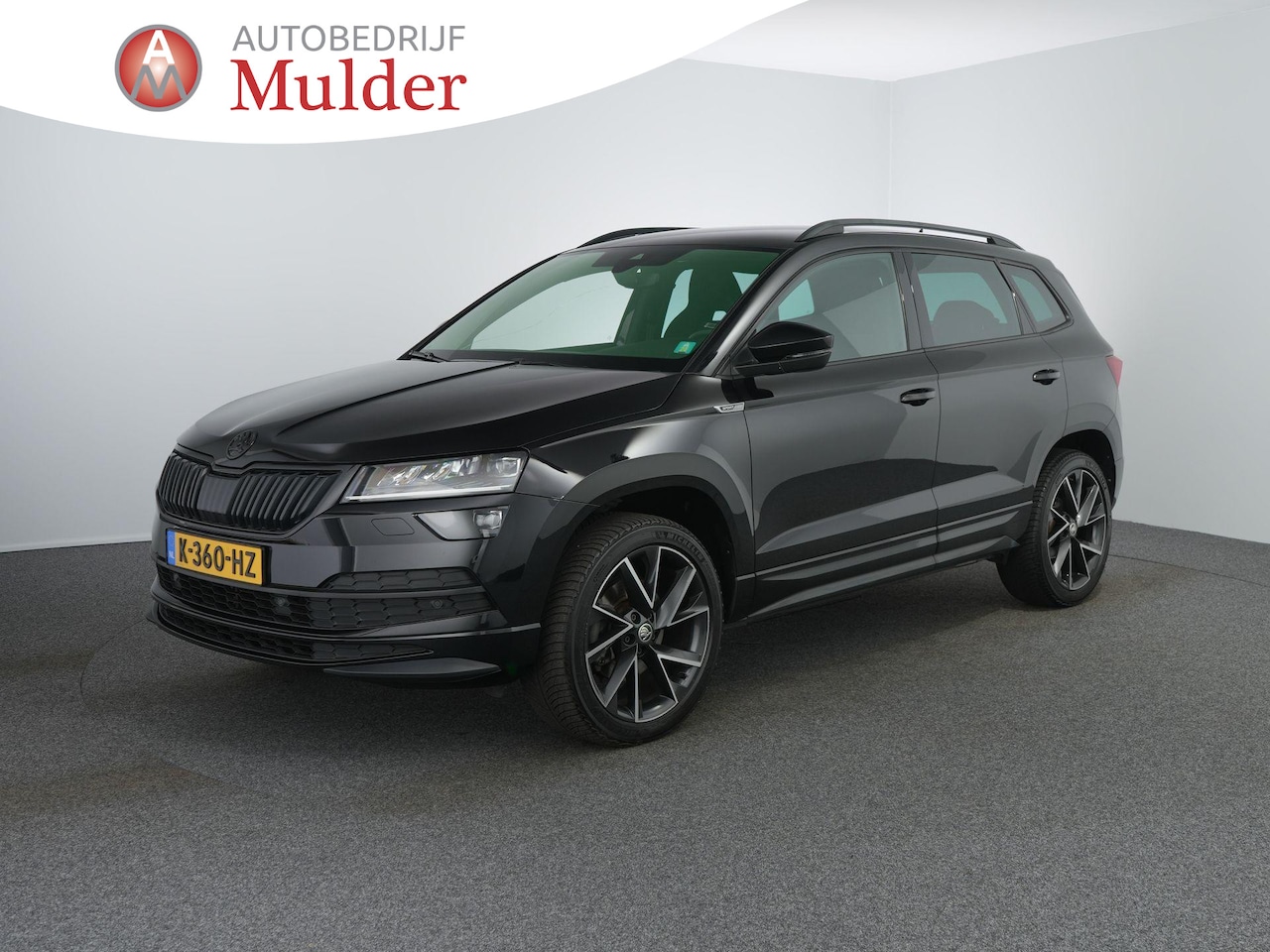 Skoda Karoq - 1.5 TSI ACT Sportline Business | Canton | Zwenkhaak | Winterpakket | Camera | ACC | - AutoWereld.nl