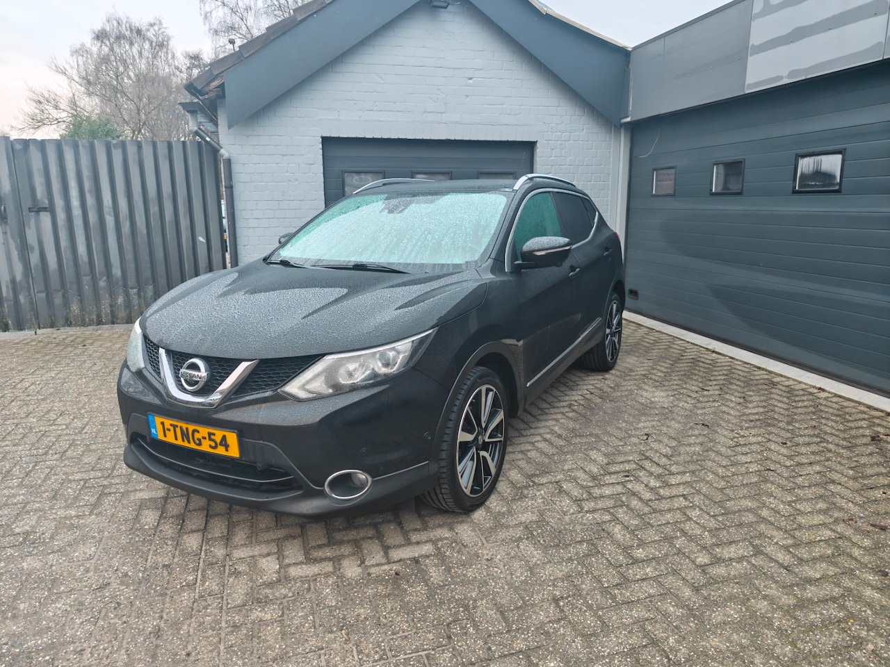 Nissan Qashqai - 1.2 Tekna 1.2 Tekna,Cruise control,Parking system,Navi,Panodak,Achteruitrijcamera,Ledere bekleding - AutoWereld.nl
