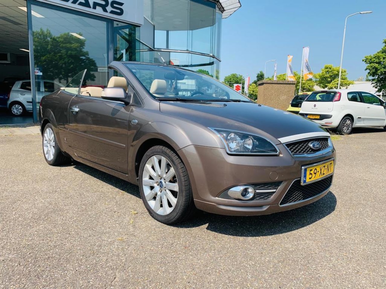 Ford Focus Coupé-Cabriolet - 2.0-16V Titanium 2.0-16V Titanium, Cabriolet, Airco, Leer, Cruise Control, Velg, P Sensor, Navi, APK, NAP - AutoWereld.nl