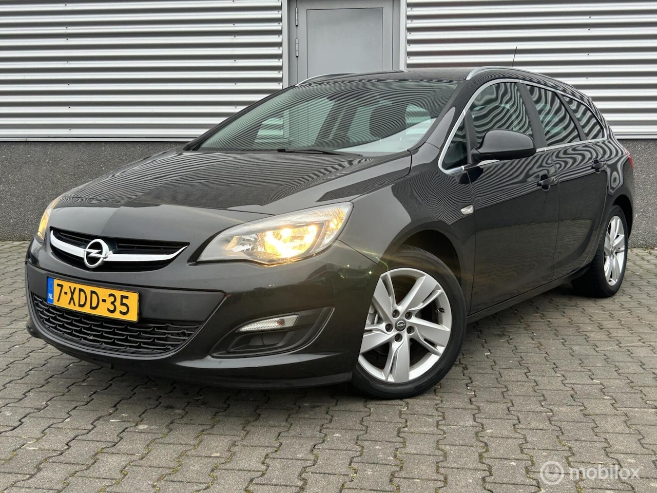 Opel Astra Sports Tourer - 1.4 Turbo Berlin 1.4 Turbo Berlin, airco,cruisecontrol - AutoWereld.nl