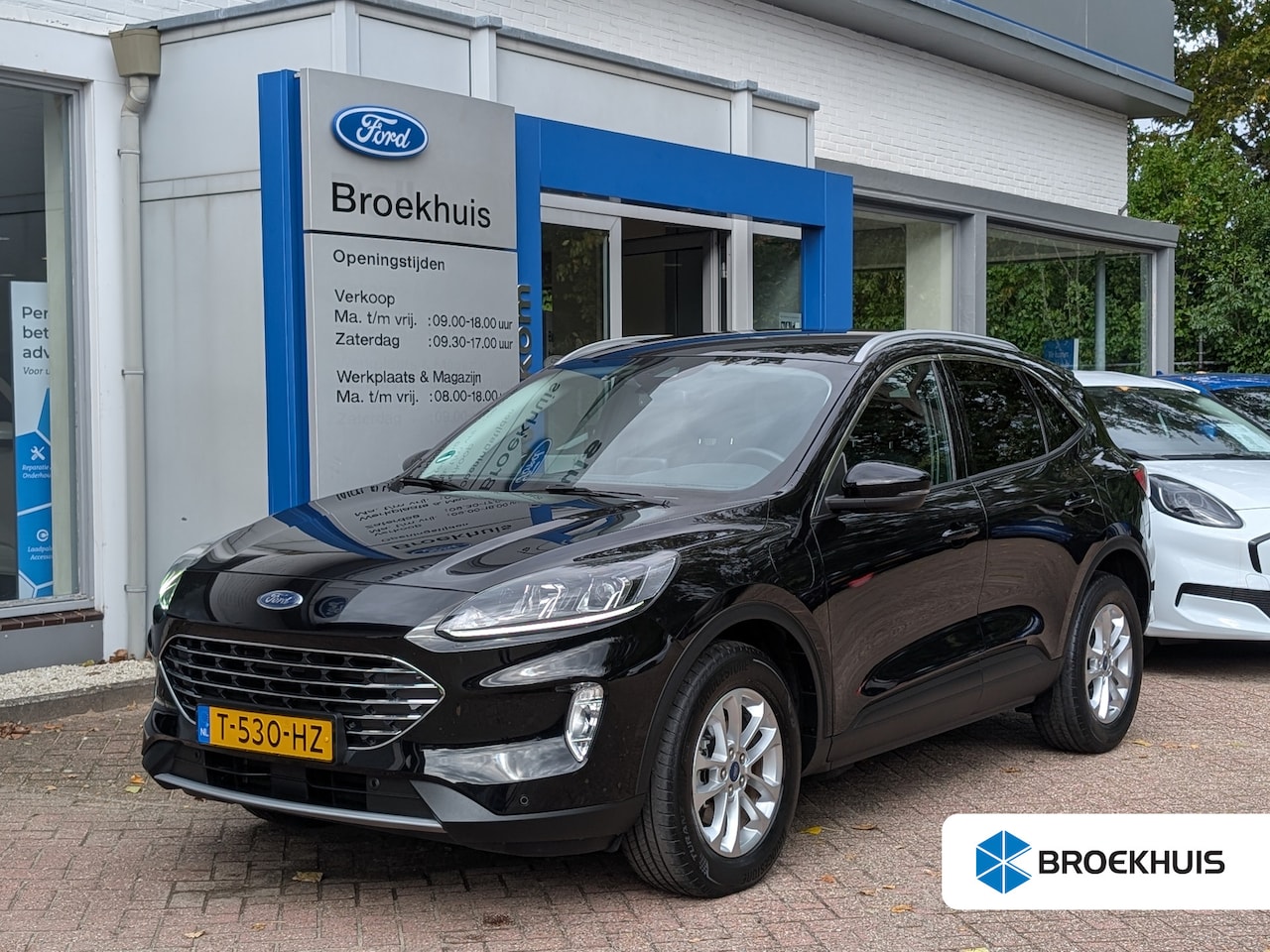 Ford Kuga - 2.5 PHEV Titanium 225pk | Camera | Climate | Carplay | Winter Pack | Dealeronderhouden & 1 - AutoWereld.nl