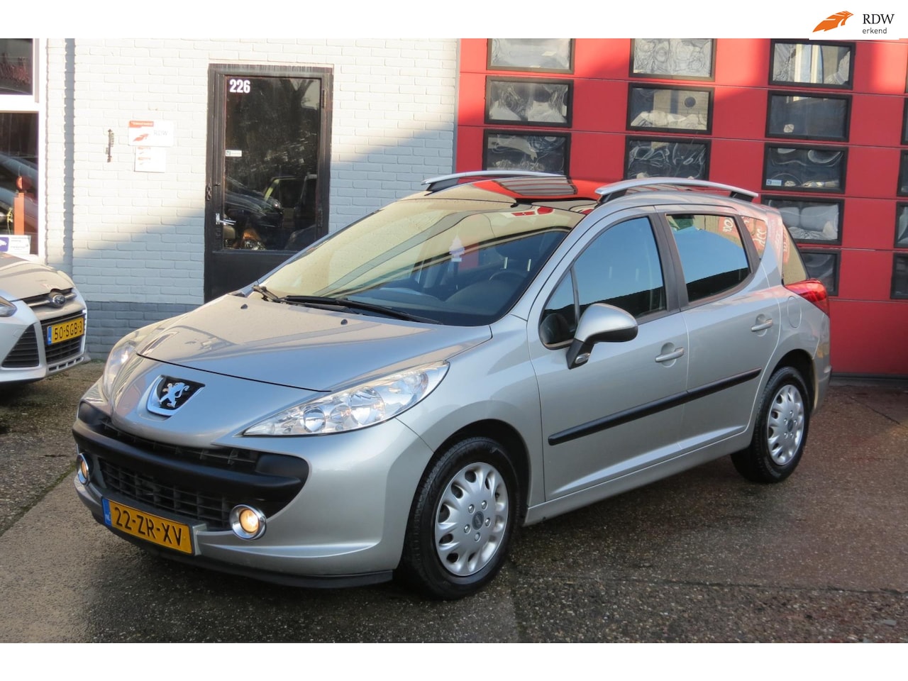 Peugeot 207 SW - 1.6 VTi XS 1.6 VTi XS , AUTOMAAT , PANO , PDC , AIRCO - AutoWereld.nl
