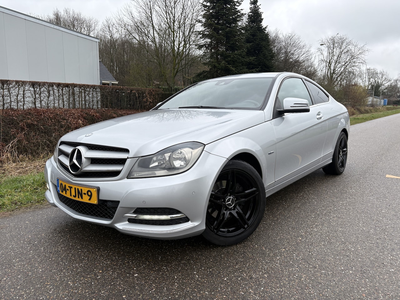 Mercedes-Benz C-klasse Coupé - 180 / AUTOMAAT / LEER / NAVI / CRUISE - AutoWereld.nl