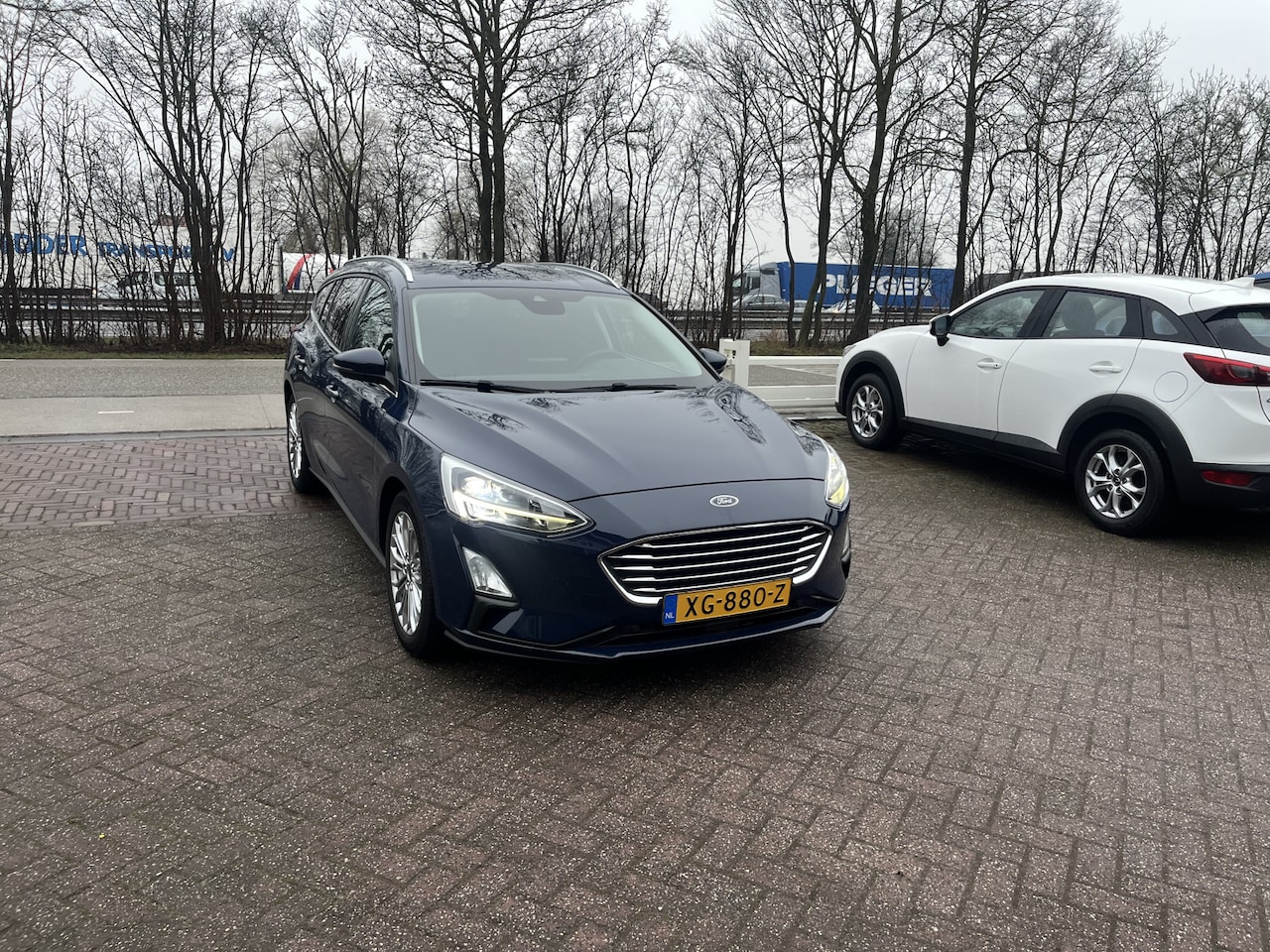 Ford Focus Wagon - 1.0 EcoBoost Titanium Business TREKHAAK CLIMA NAVI KEYLESS - AutoWereld.nl