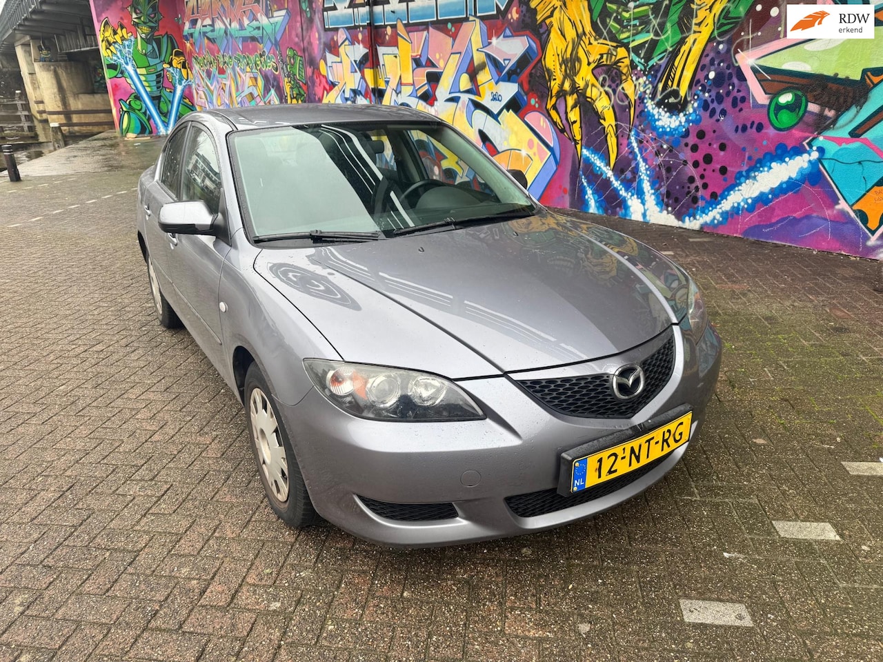 Mazda 3 - 1.6 Touring met Let op originele km stand van 150.000 km nap airco heeft roest aan wiel ra - AutoWereld.nl