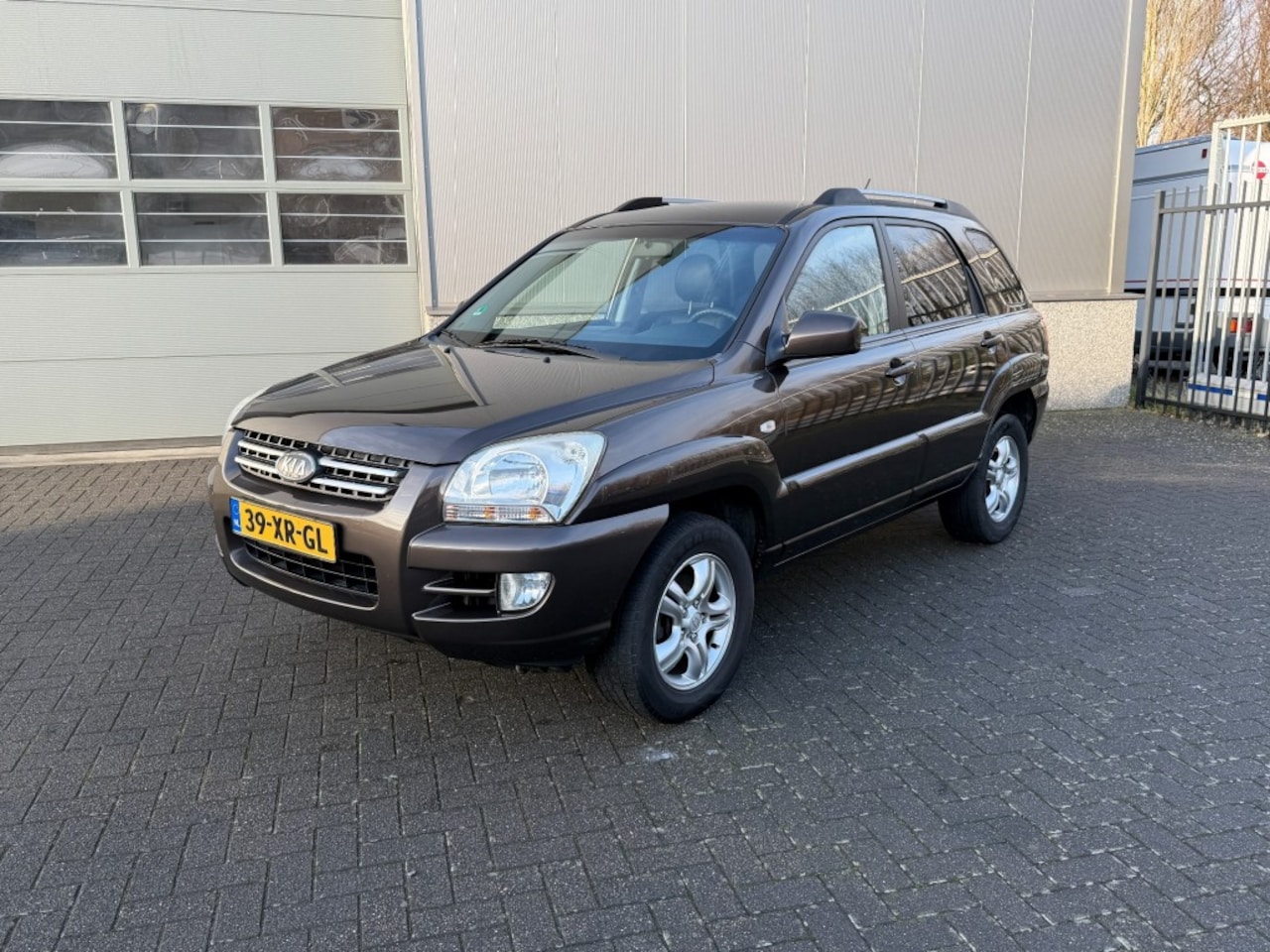 Kia Sportage - 2.0 CVVT X-ecutive 2.0 CVVT X-ECUTIVE - AutoWereld.nl