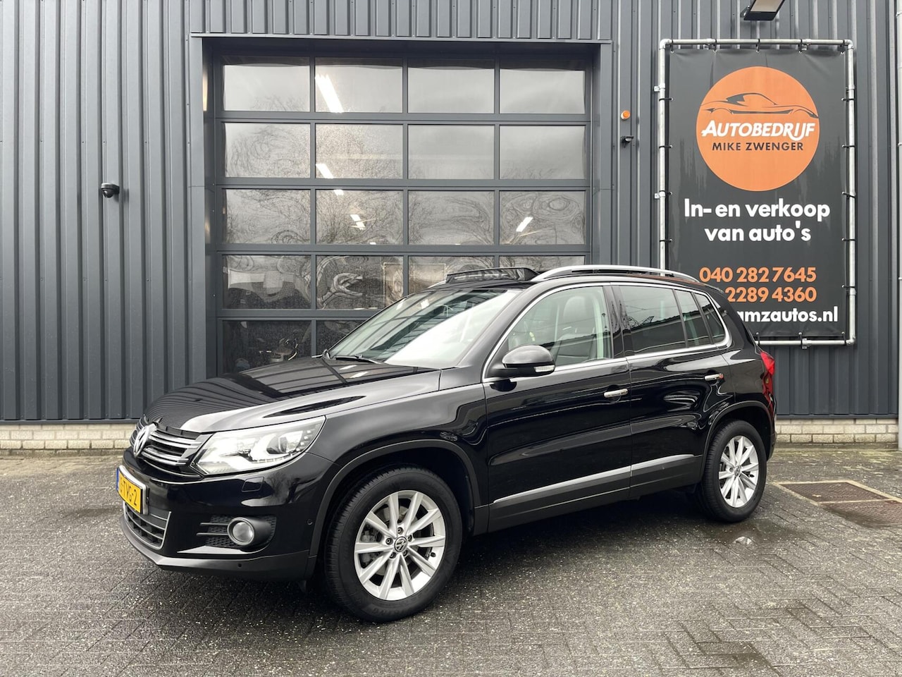 Volkswagen Tiguan - 1.4 TSI Sport&Style PANORAMADAK|TREKHAAK|LEER|NAVIGATIE|XENON|RIJSTROOK SENSOR - AutoWereld.nl
