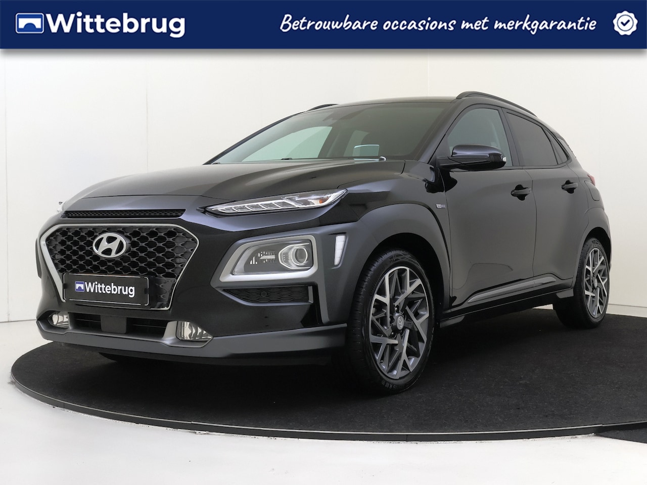 Hyundai Kona - 1.6 GDI HEV Premium | Stoelverwarming en Koeling | Camera | Carplay | Premium Audio - AutoWereld.nl