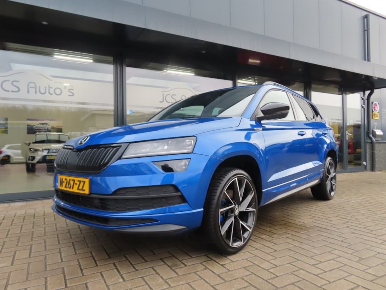 Skoda Karoq - 1.5 TSI Sportline Business Led Pano Trekhaak 2022 - AutoWereld.nl
