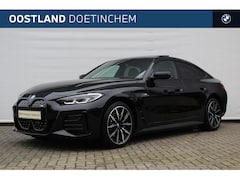 BMW i4 - eDrive40 High Executive M Sport / Schuif-kanteldak / Achteruitrijcamera / Stoelverwarming