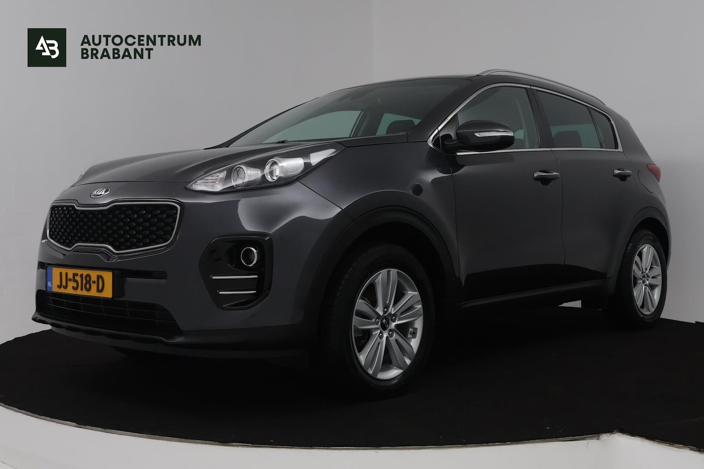 Kia Sportage - 1.6 GDI First Edition (TREKHAAK, ACHTERUITRIJCAMERA, NAVIGATIE, CRUISE CONTROL, PARKEERSEN - AutoWereld.nl