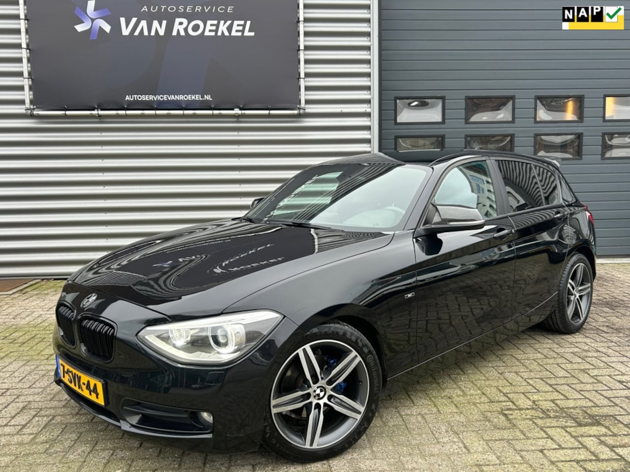 BMW 1-serie - 116i Sport | PDC | Navi | Clima | Cruise | Bluetooth - AutoWereld.nl