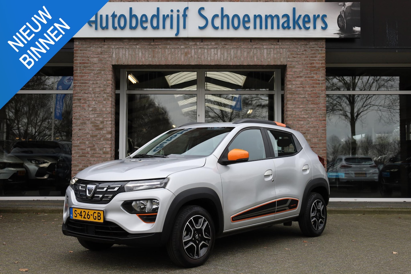 Dacia Spring - Comfort Plus (Orange Pack) 27 kWh LEER DAB NAVI CRUISE BT-TELEFOONVERB. VOICE PDC LMV - AutoWereld.nl