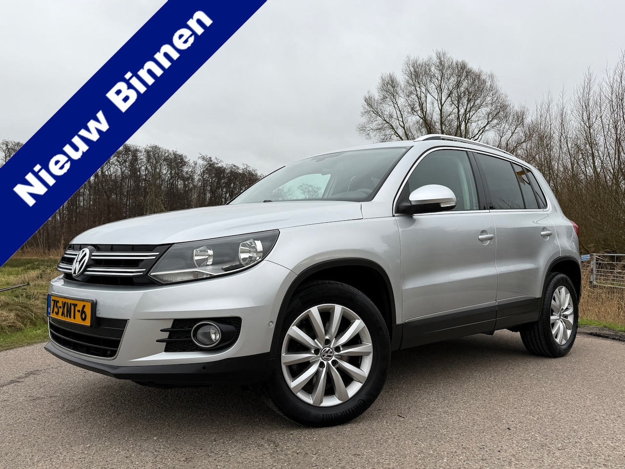 Volkswagen Tiguan - 1.4 TSI Sport&Style | 1e Eigenaar | slechts 143.582 km | Navi | Trekhaak | Clima | 17" Vel - AutoWereld.nl