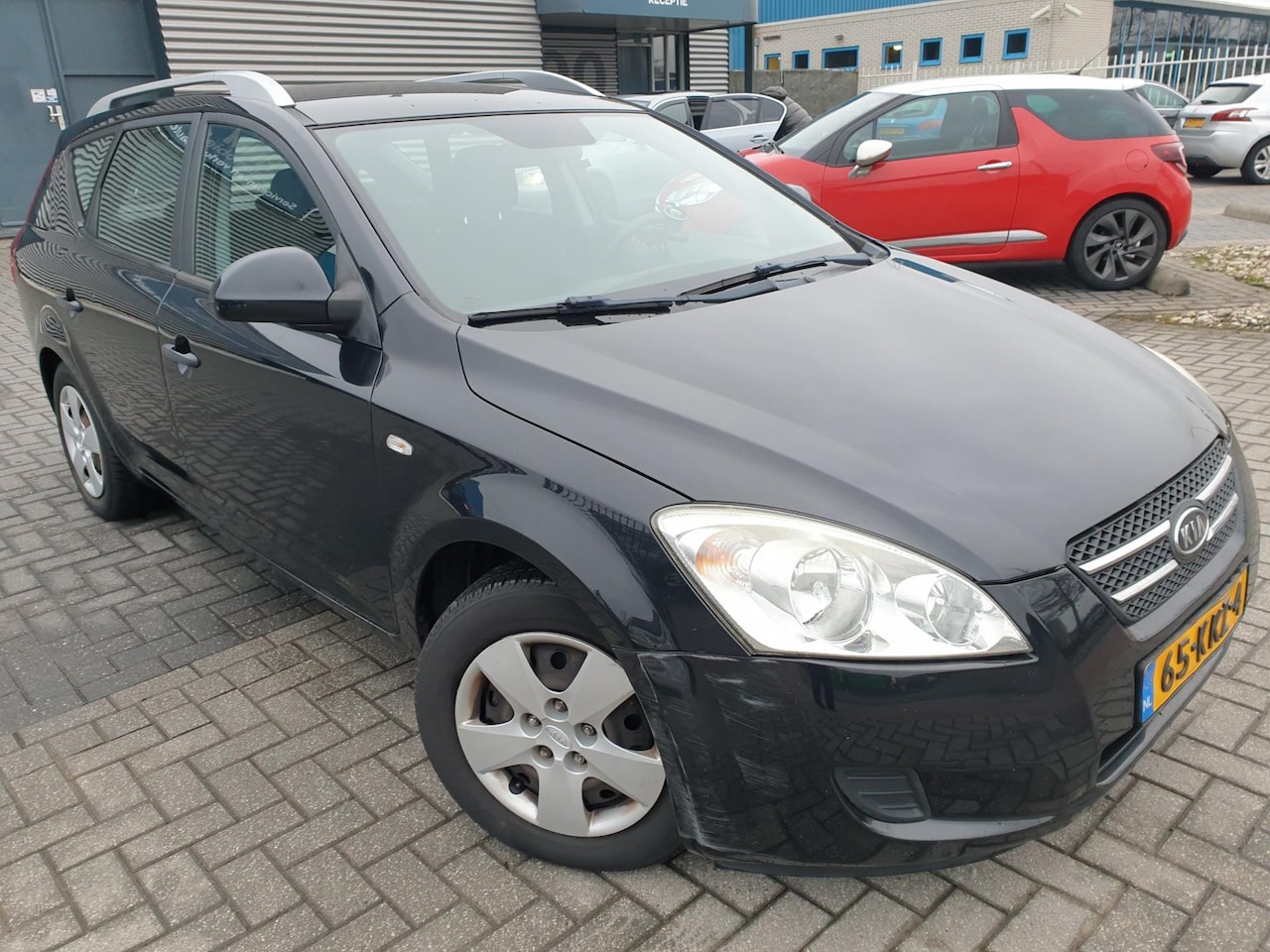 Kia Cee'd Sporty Wagon - 1.4 CVVT X-tra 1.4 CVVT X-tra - AutoWereld.nl