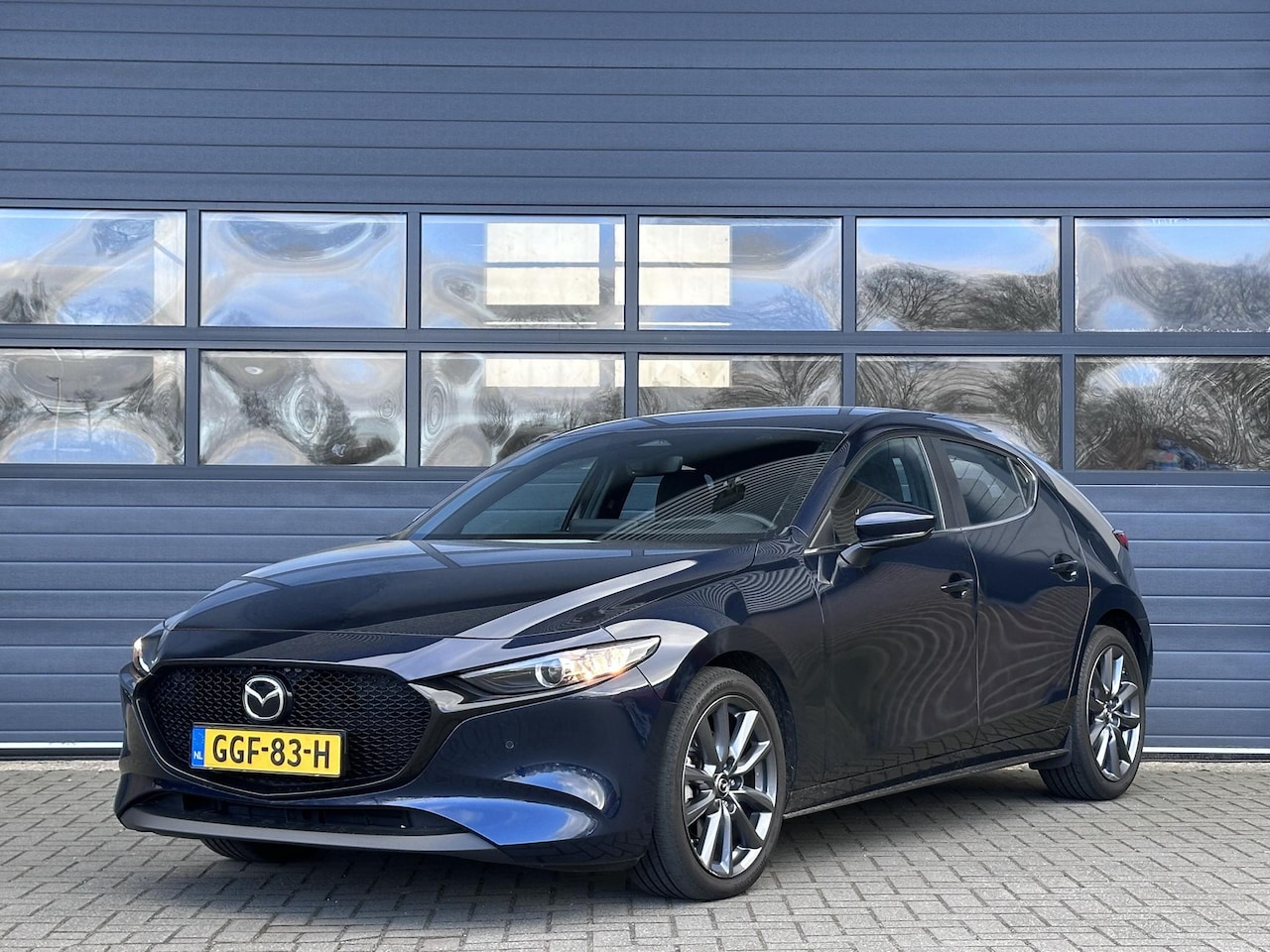 Mazda 3 - 2.0 E-SKYACTIV-X M HYBRID 186 HOMURA I P-CAMERA I ADAPTIVE CRUISE CONTROL I NAVIGATIE I CL - AutoWereld.nl