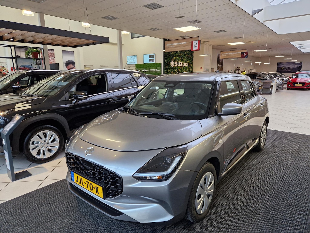 Suzuki Swift - 1.2 Comfort Smart Hybrid | Black Rhino pack - AutoWereld.nl