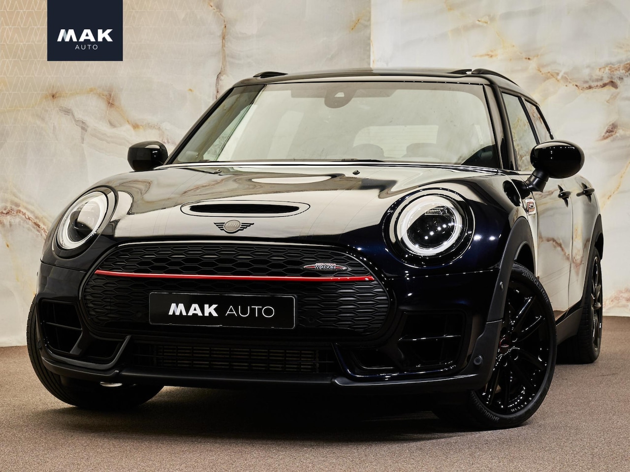 MINI Clubman - 2.0 JCW ALL4 John Cooper Works 2.0 JCW ALL4 John Cooper Works, JCW Pro, pano, JCW-stoelen, 18", H/K, HUD, keyless, ACC, p - AutoWereld.nl