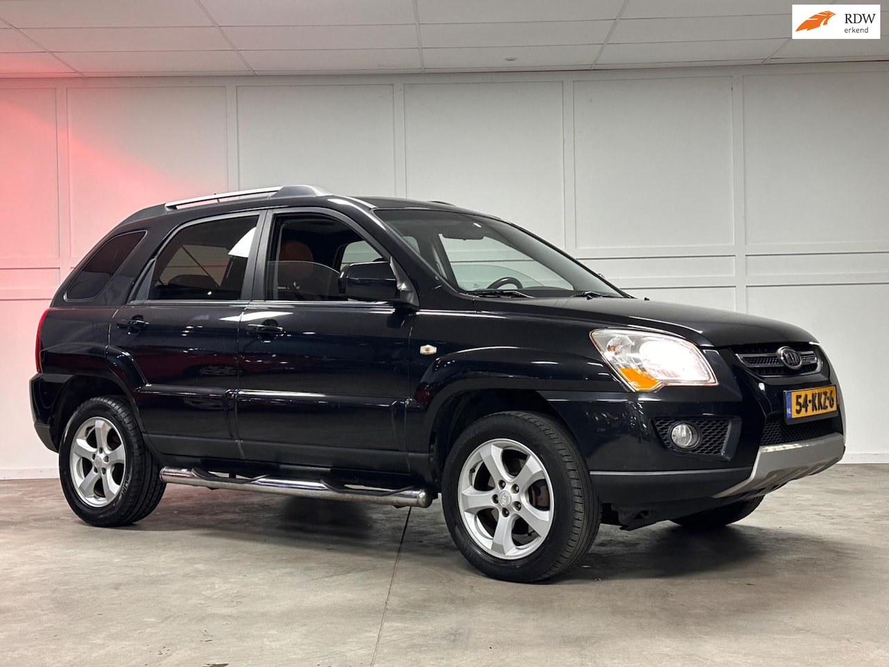 Kia Sportage - 2.0 CVVT Fifteen / Airco / Cruise / Navi / Leer - AutoWereld.nl