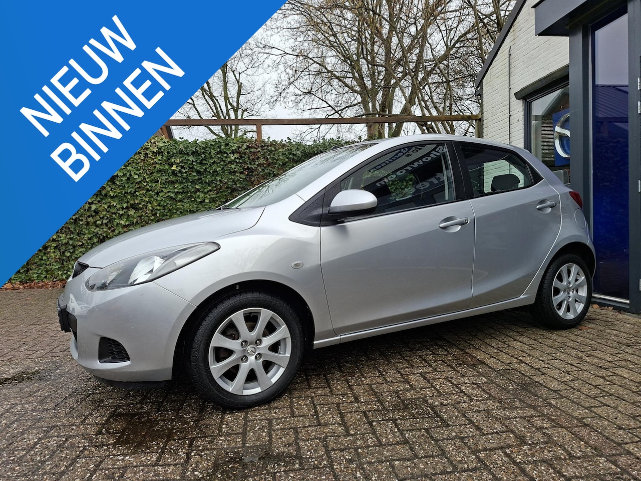 Mazda 2 - 1.3 TS airco, cruise, trekhaak - AutoWereld.nl