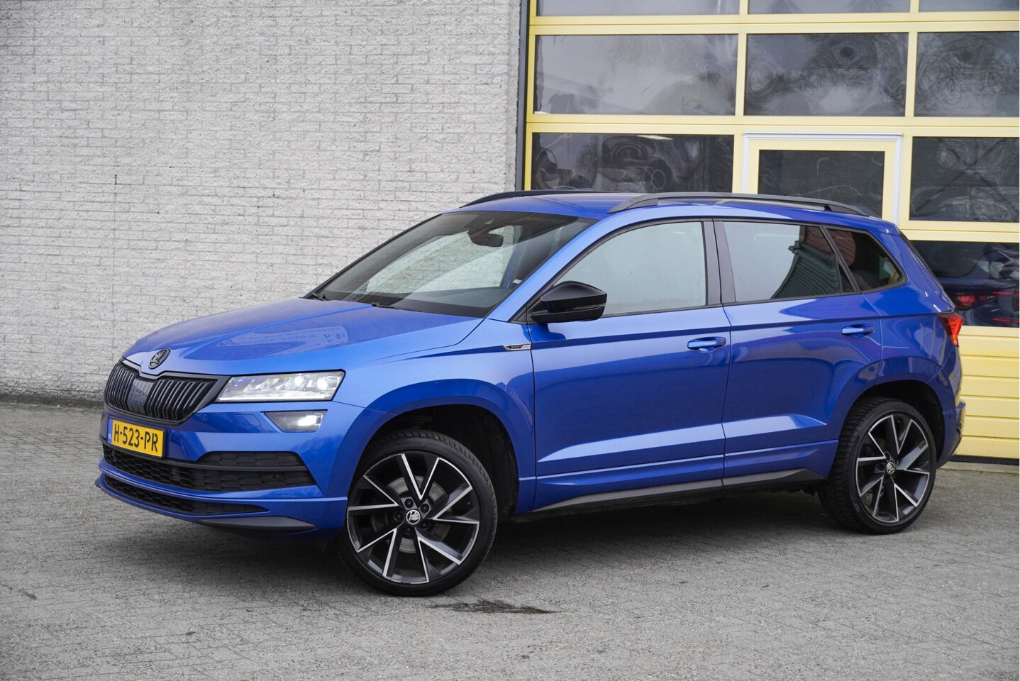 Skoda Karoq - 1.5 TSI ACT 150PK! Automaat Sportline Business BJ2020 Lmv 19" | Led V+A | Pdc | Navi | Key - AutoWereld.nl