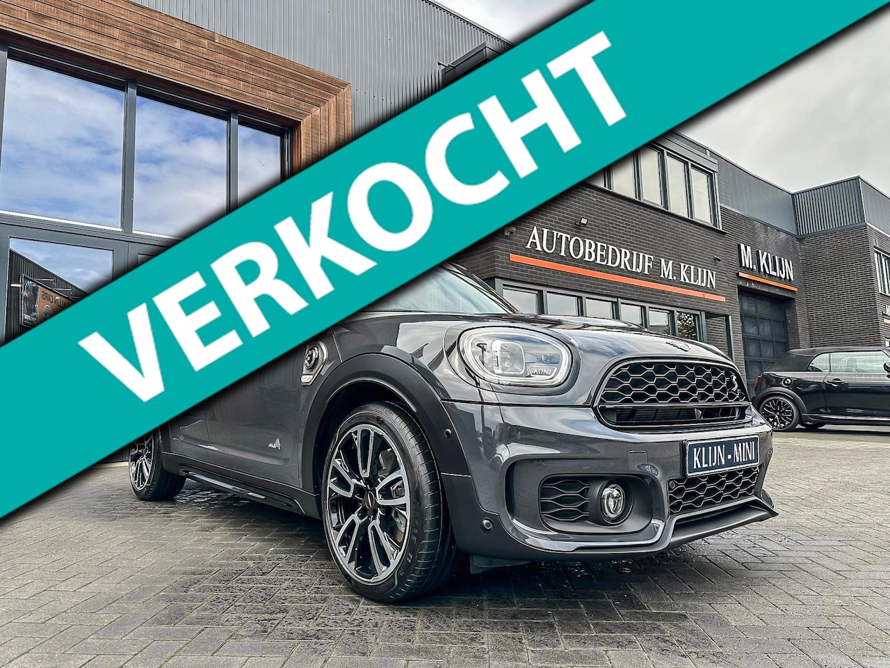 MINI Countryman - Mini 2.0 Cooper S E ALL4 John Cooper Works 220pk/bruin leer/pano/camera/19"/Vol - AutoWereld.nl