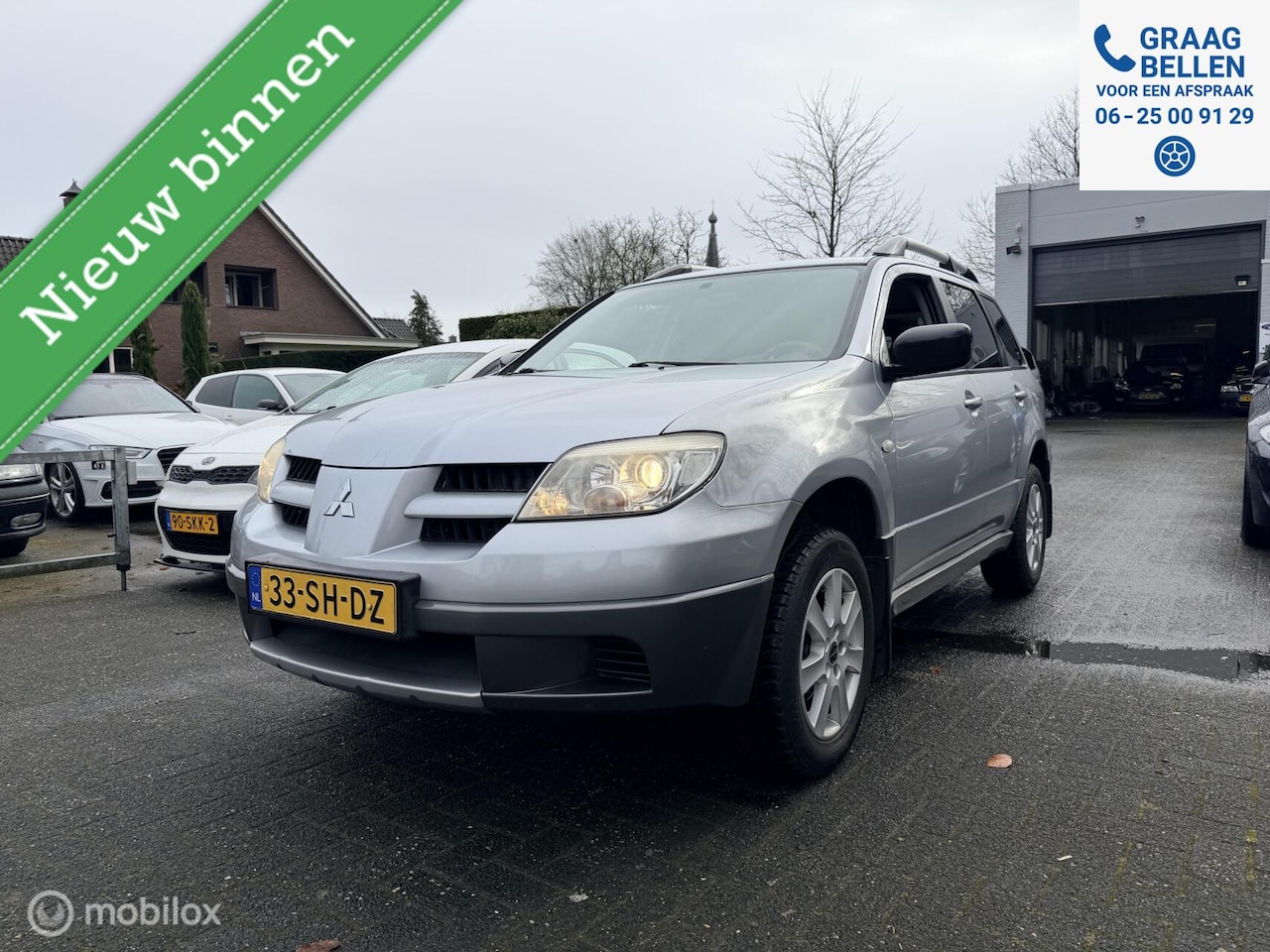 Mitsubishi Outlander - 2.0 Invite plus LM / PDC / Trekhaak / Parrot - AutoWereld.nl