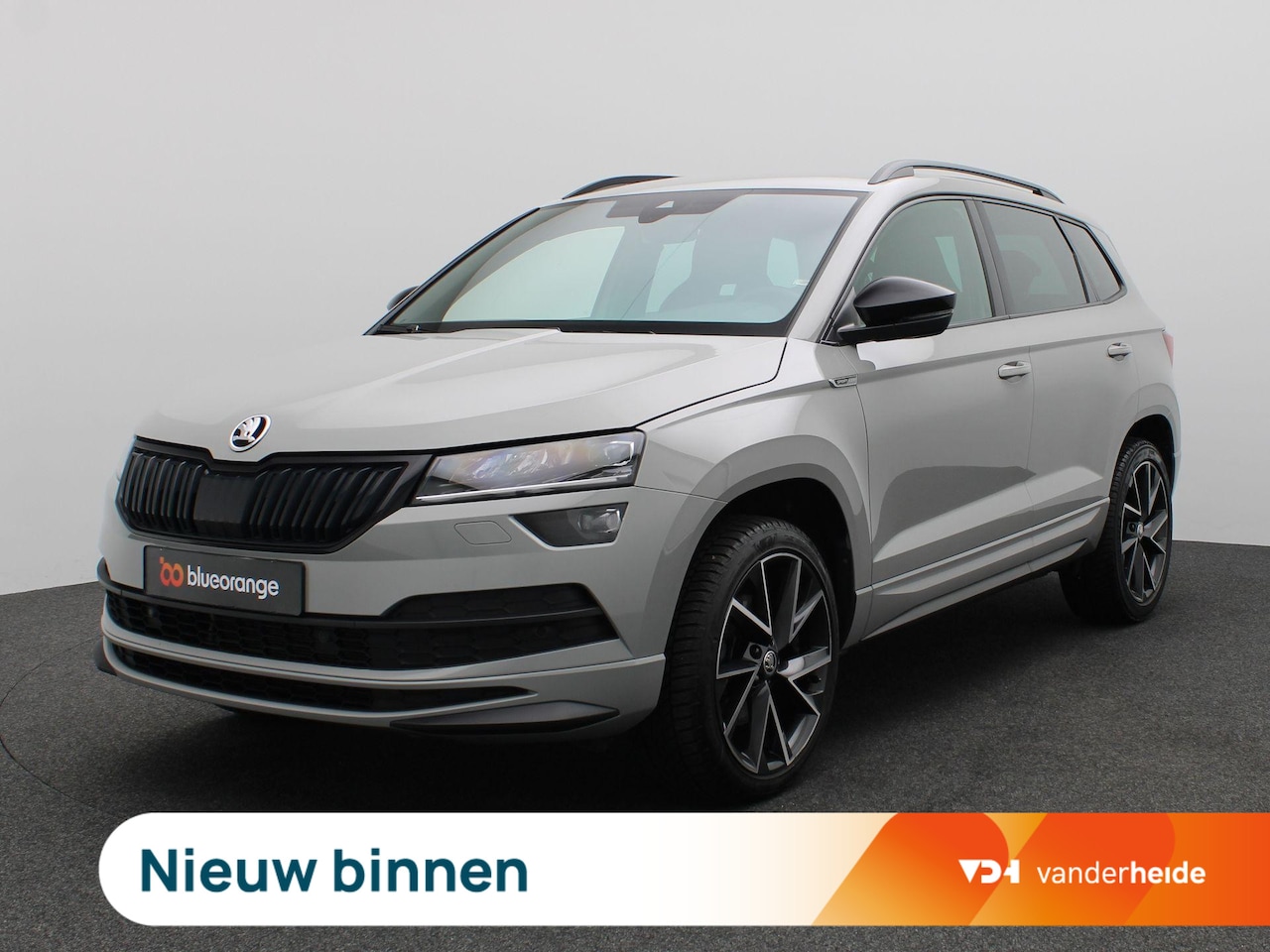 Skoda Karoq - 1.5 TSI ACT Sportline Business 150PK DSG Trekhaak, Canton Audio, 19" LM Velgen, Elektr. Ac - AutoWereld.nl