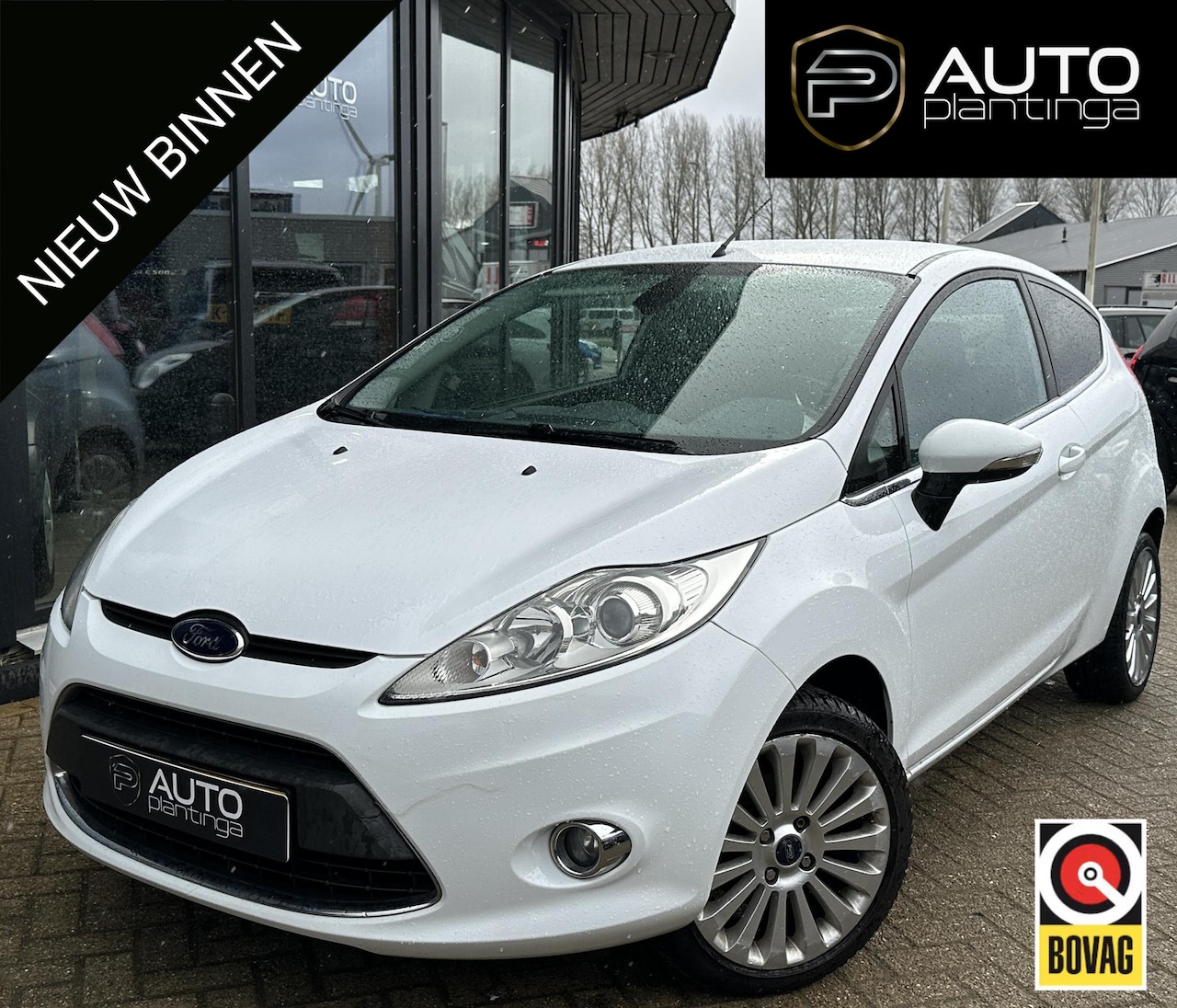 Ford Fiesta - 1.25 Titanium 82PK | Lederen Bekleding | Parkeersensoren | Climate Control | Voorruitverwa - AutoWereld.nl