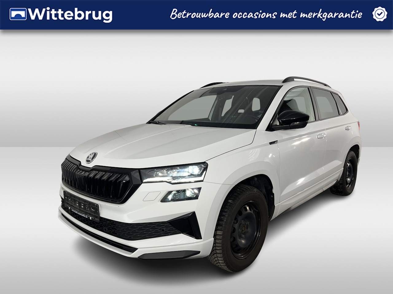 Skoda Karoq - 1.5 TSI ACT Sportline / TREKHAAK/ STUUR+STOELVERWARM.V+A/ PARK.SENSOR.V+A/ CAMERA/ DCC/ SM - AutoWereld.nl