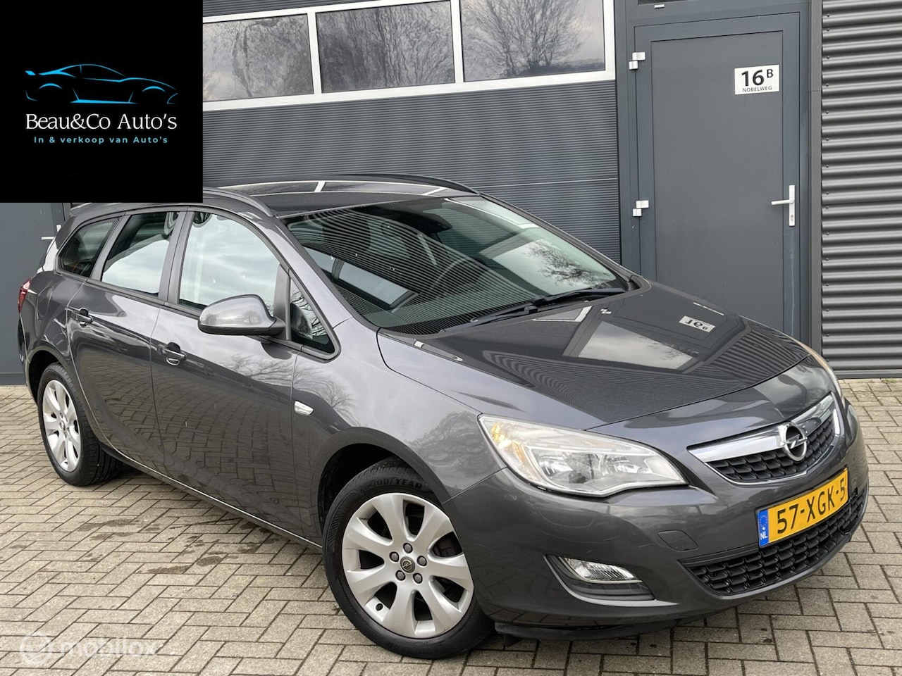 Opel Astra Sports Tourer - 1.4 Cosmo | Dealer ond! | Trekhaak - AutoWereld.nl