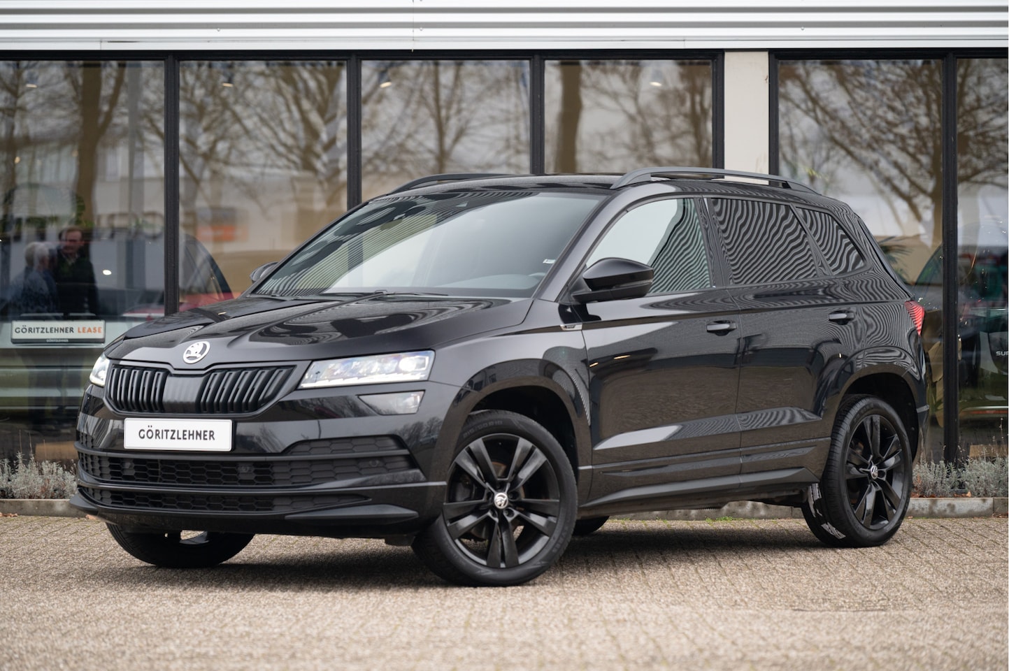 Skoda Karoq - 1.5 TSI ACT Sportline Business | ACC | Navi | Apple CarPlay | CANTON Audio | Camera - AutoWereld.nl