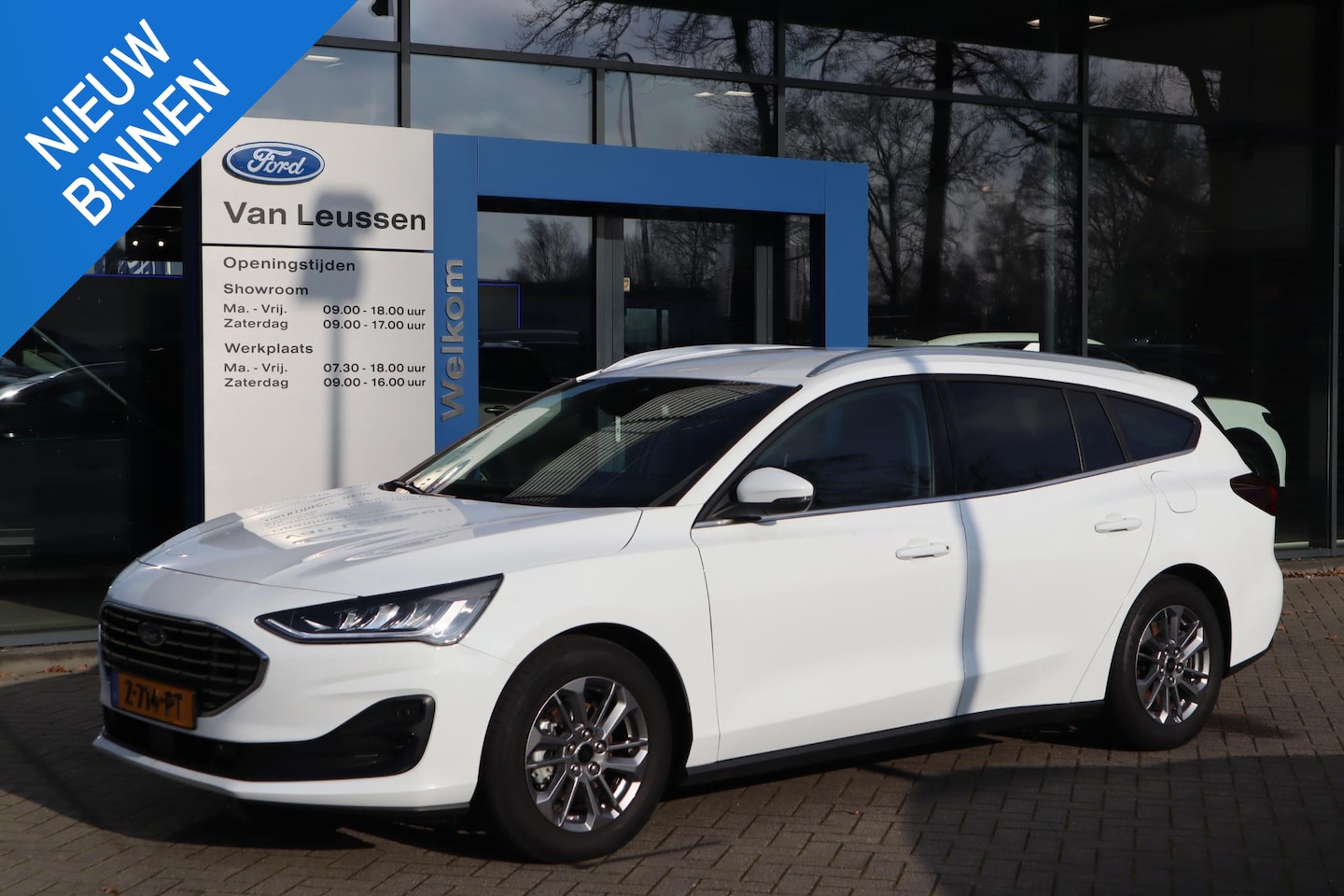 Ford Focus Wagon - 125PK HYBRID TITANIUM NAVI CRUISE CLIMA APPLE/ANDROID PARK-SENSOREN PRIVACY-GLASS LM-VELGE - AutoWereld.nl