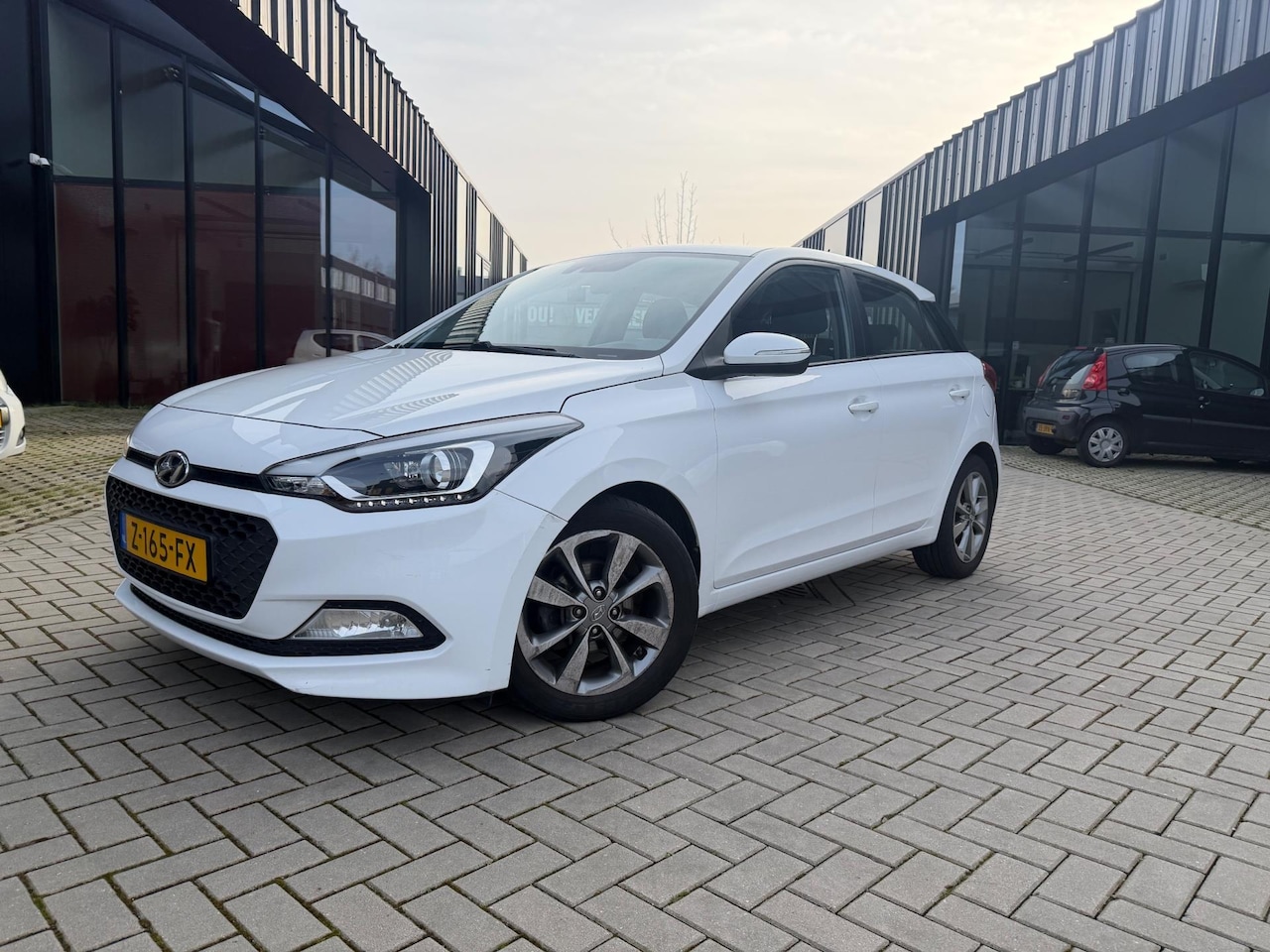 Hyundai i20 - 1.2 HP i-Motion Airco Cruise Nwe APK - AutoWereld.nl