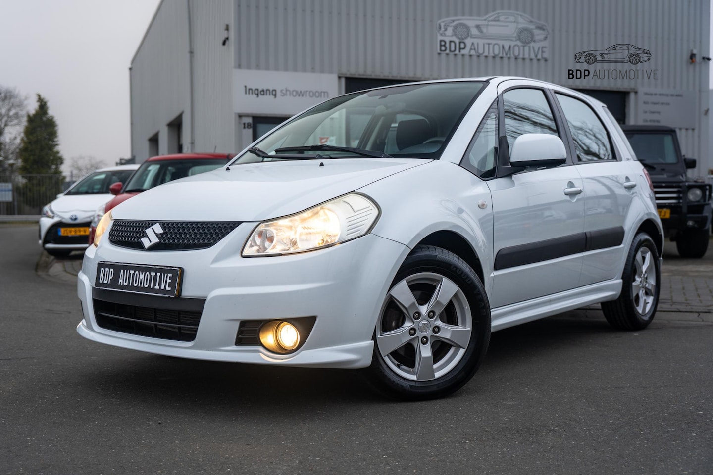 Suzuki SX4 - 1.6 Exclusive ✅Lage km | Airco | Cruise | Stoelverwarming | Keyless - AutoWereld.nl
