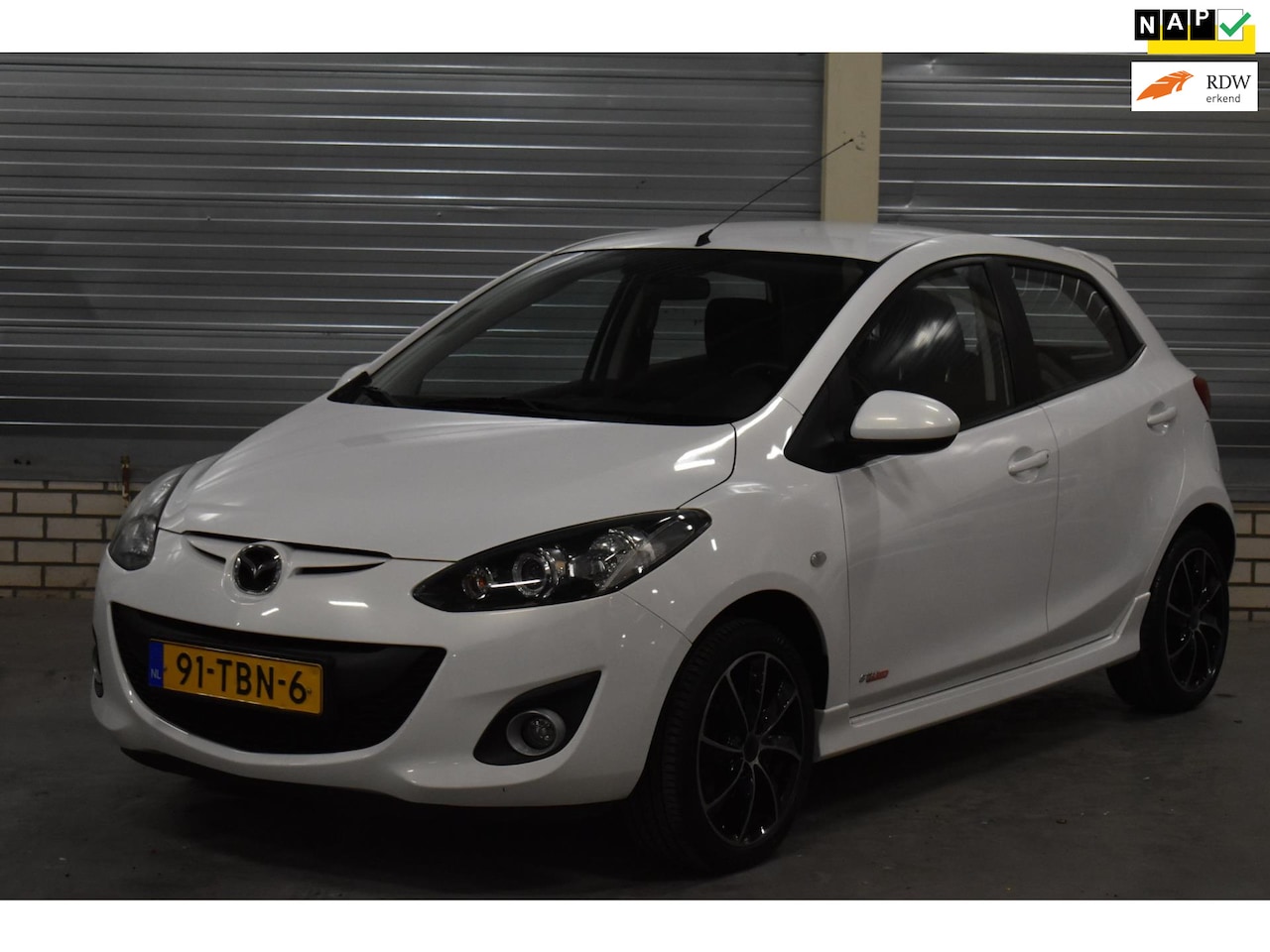 Mazda 2 - 1.3 GT-M Line 82.000KM!!! Parelmoer Wit + Airco|Stoelverwarming| - AutoWereld.nl
