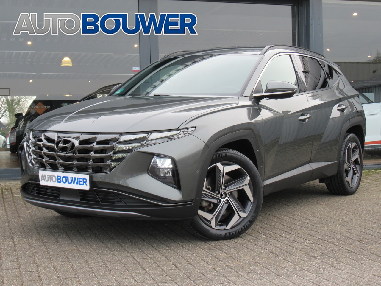 Hyundai Tucson - 1.6 T-GDI 230PK HEV Premium 2e eigen | dealer onderh | leder | 360 camera | elektr.stoelen - AutoWereld.nl