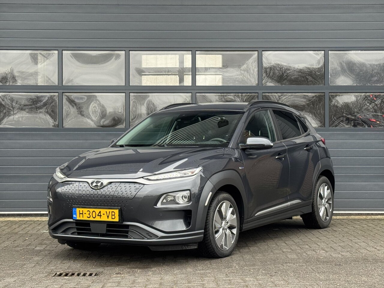 Hyundai Kona Electric - EV PREMIUM 64 KWH I LEDEREN BEKLEDING I 3-FASE I 100% SOH I STOELVERWARMING I APPLE CARPLA - AutoWereld.nl