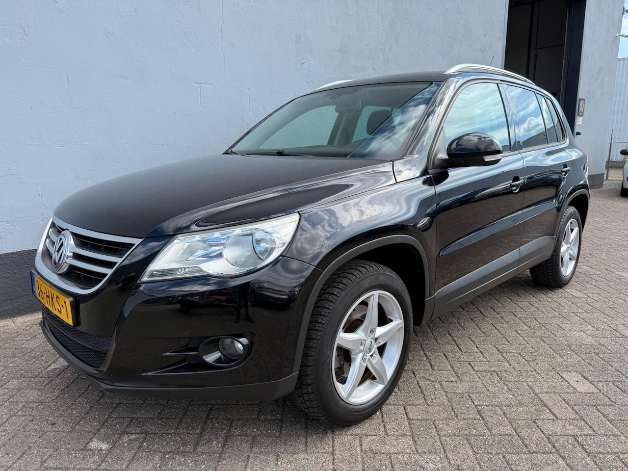 Volkswagen Tiguan - 1.4 TSI Sport&Style - Trekhaak - AutoWereld.nl